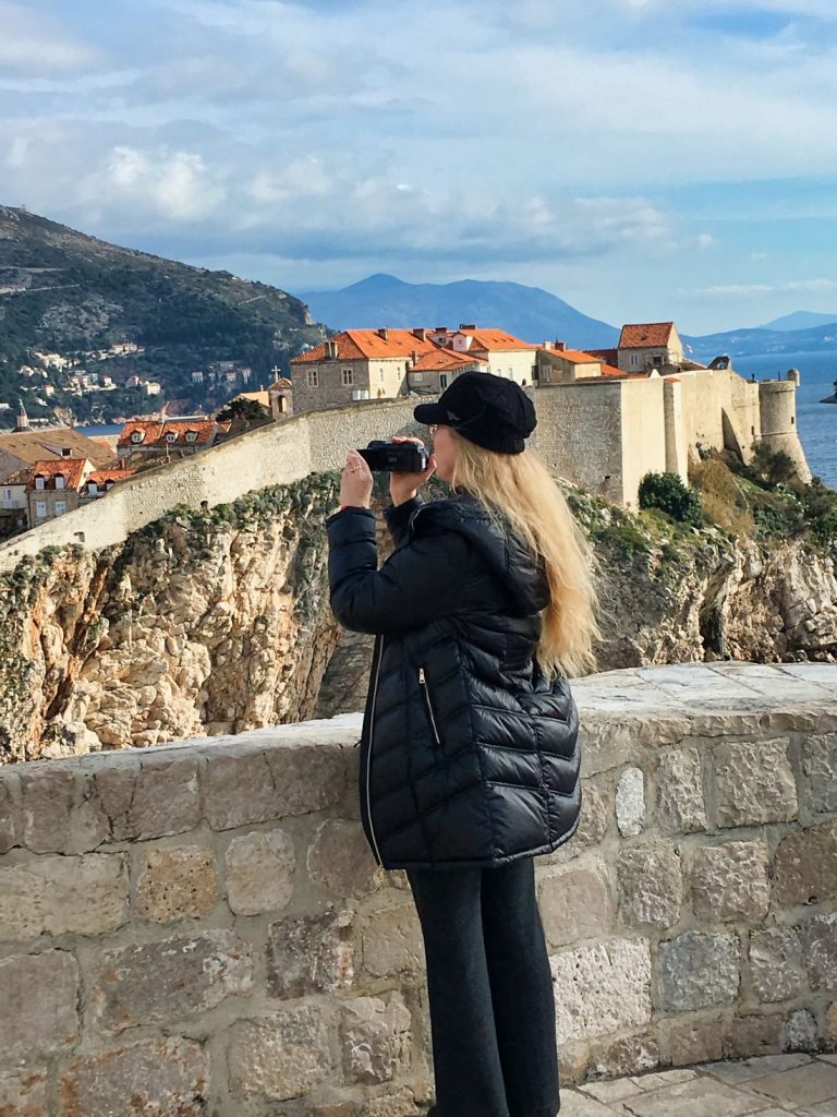 Dina with video camera on the wall in Dubrovnik, Croatia